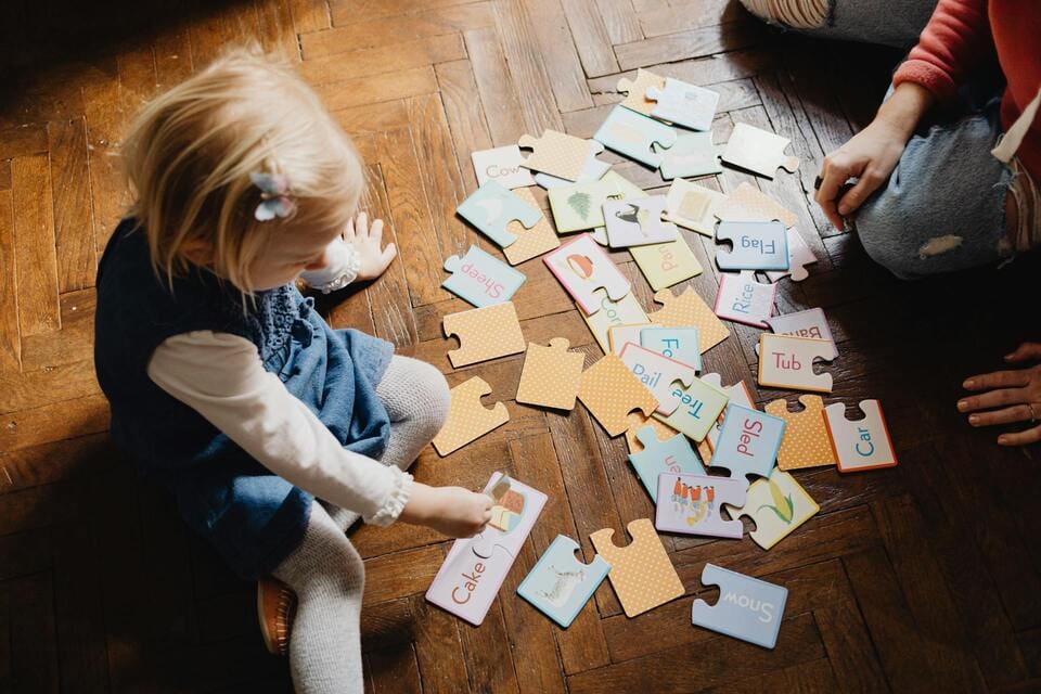 Kids playing on durable, pet-friendly hardwood flooring in a busy family home in Charlotte, NC