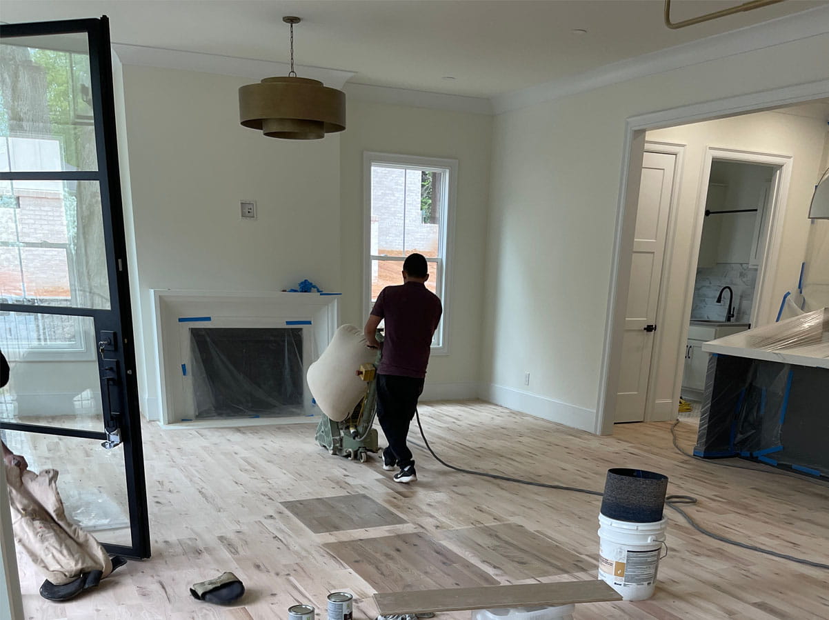 Hardwood floor refinishing process to restore long-lasting natural wood flooring inside a residential home