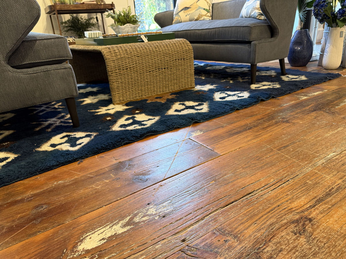 Worn hardwood floor with scratches and dull finish needing professional restoration instead of replacement